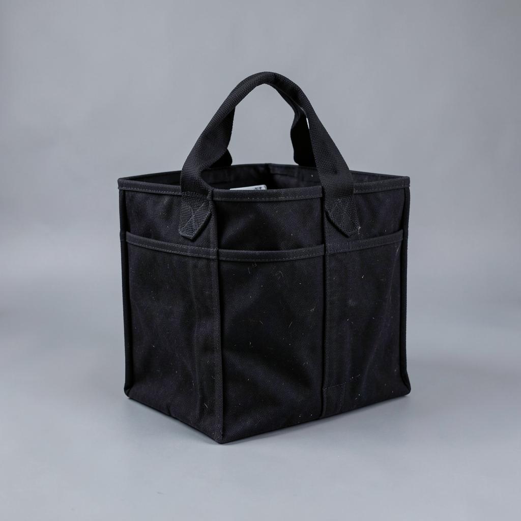 Heavy black canvas firewood and tool carrier tote with reinforced handles