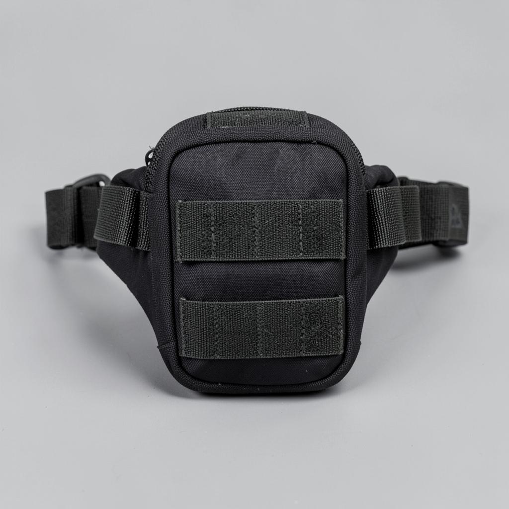 Slim black tactical waist pack with belt and MOLLE loops